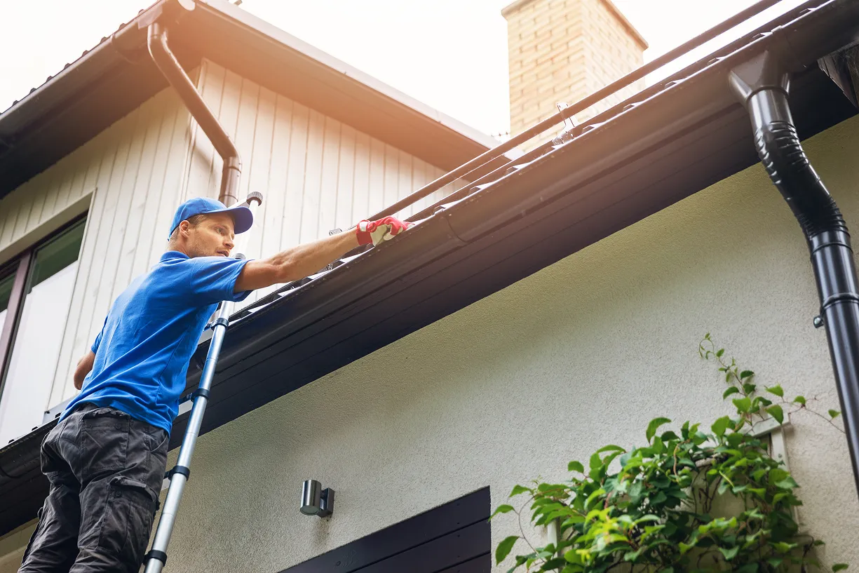 Gutter cleaning on a two-story home