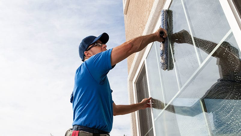 Window being squeegeed clean